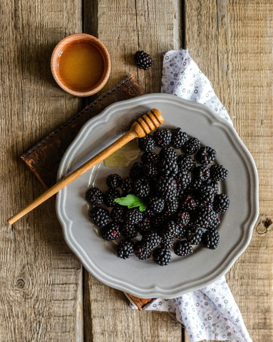 Fresh blackberries and honey
