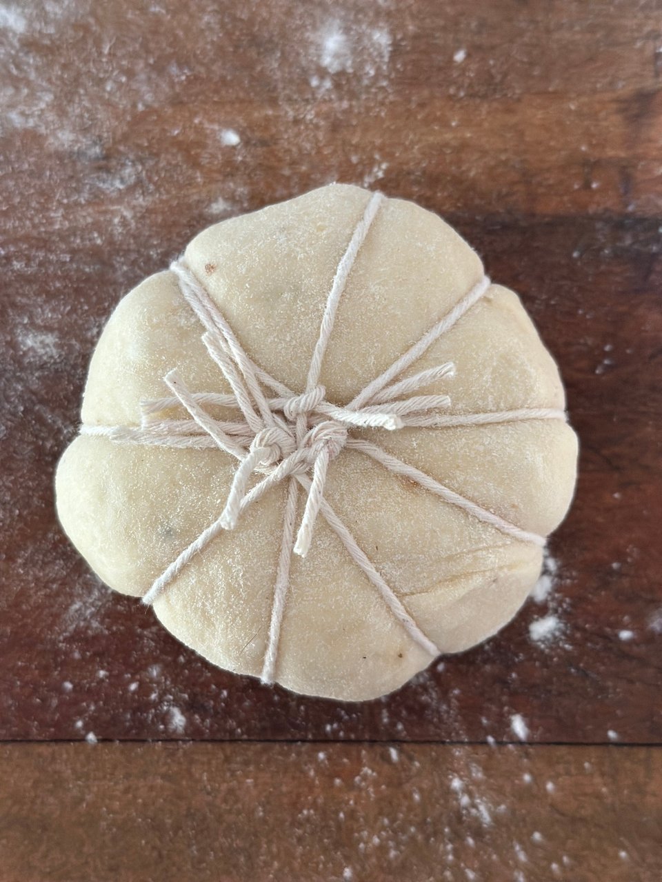 Dough balls wrapped with twine