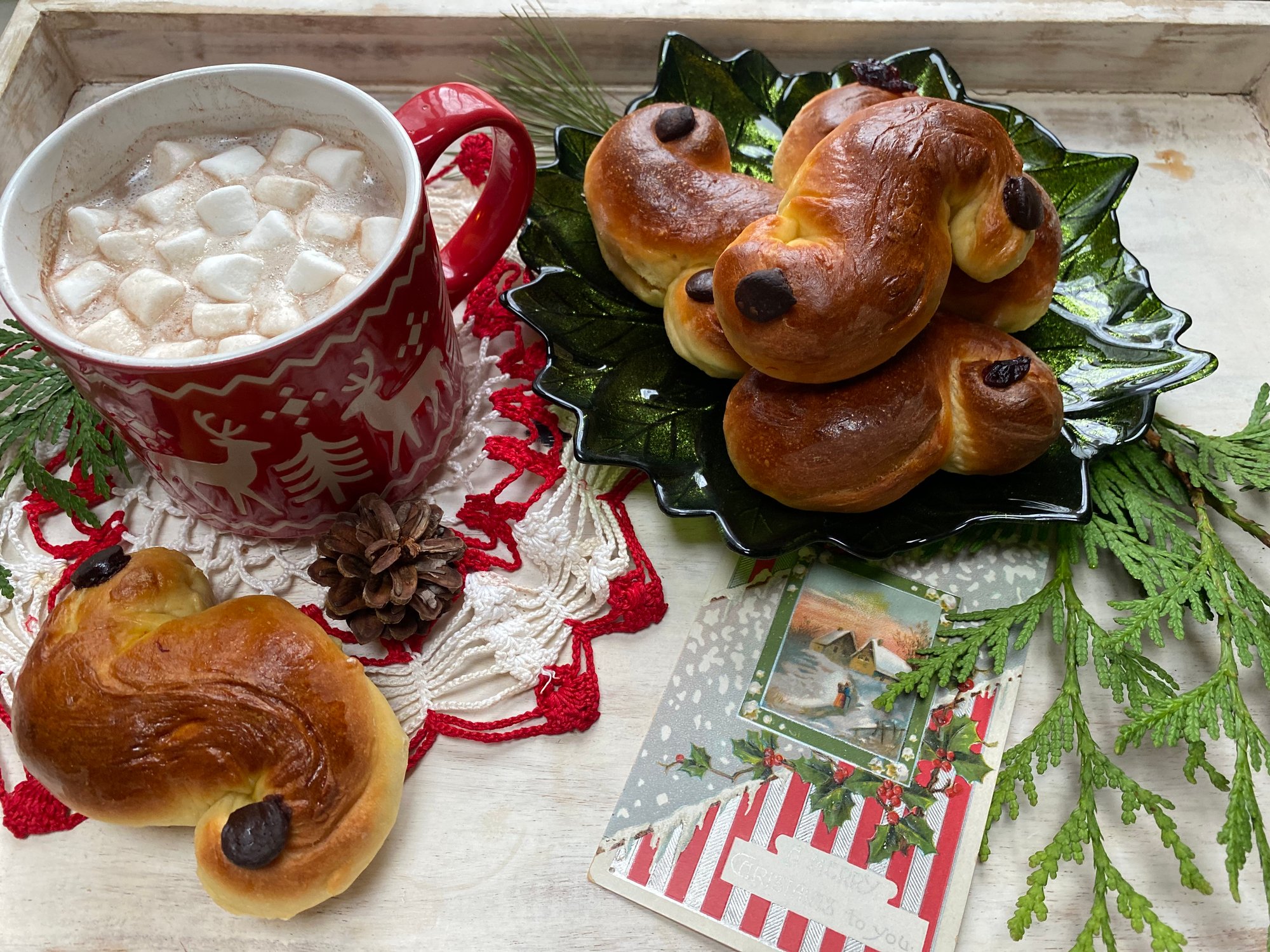 St. Lucia buns served with hot chocolate and marshmallows